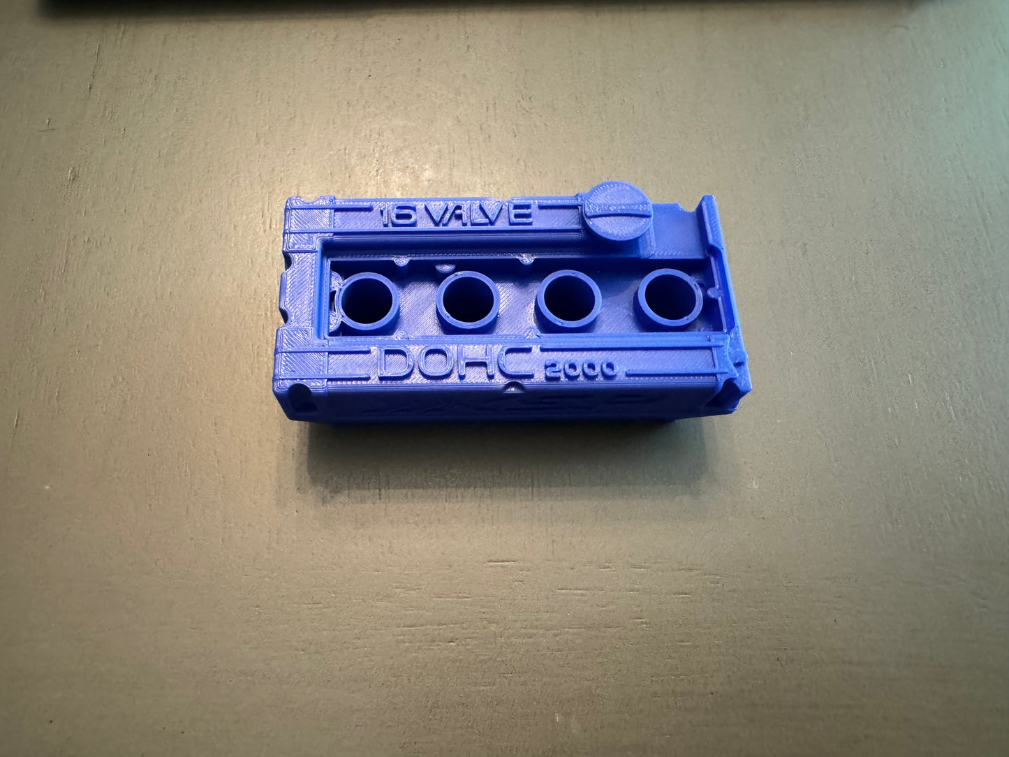 DSM valve cover spark plug holder